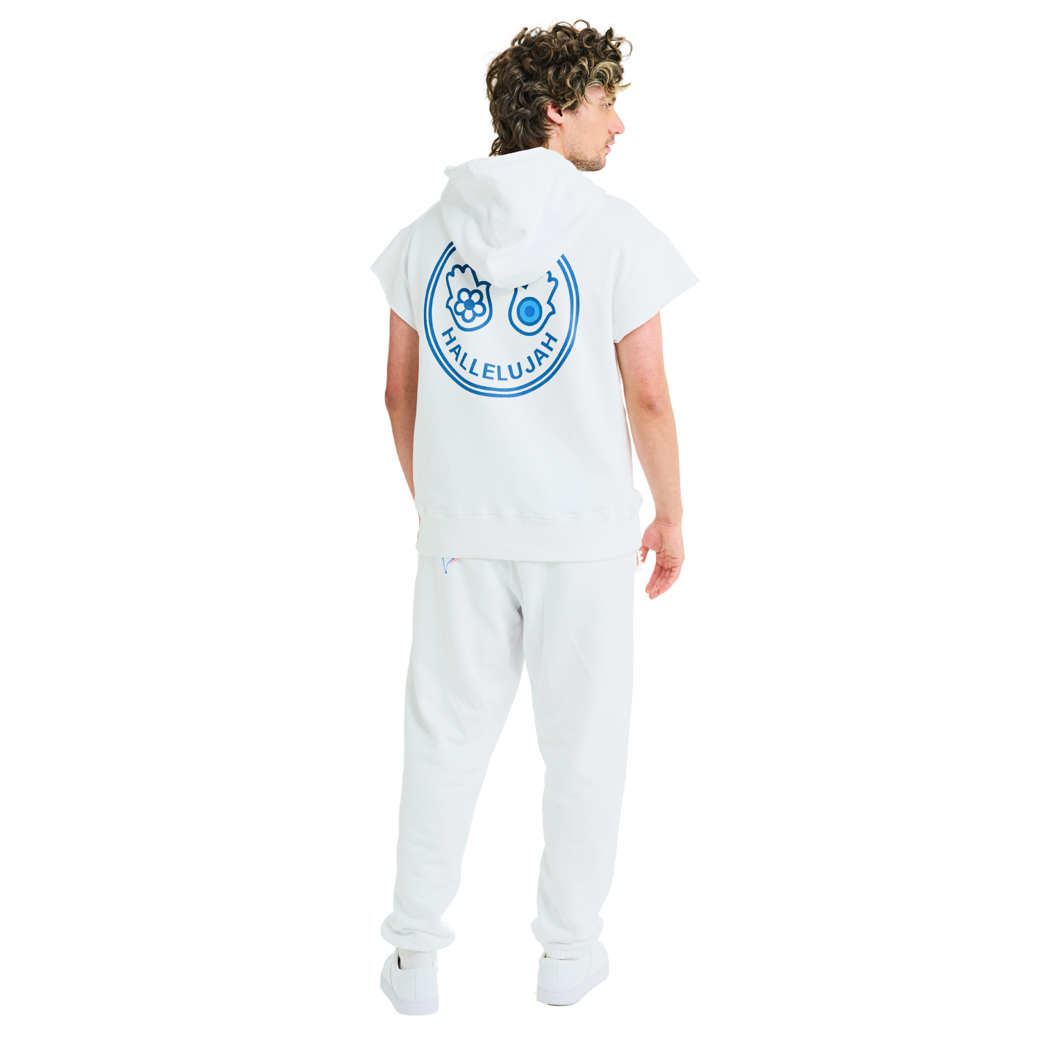 Back view of male model in unisex white short-sleeved hoodie with Club Hallelujah hamsa print and cowrie shell details