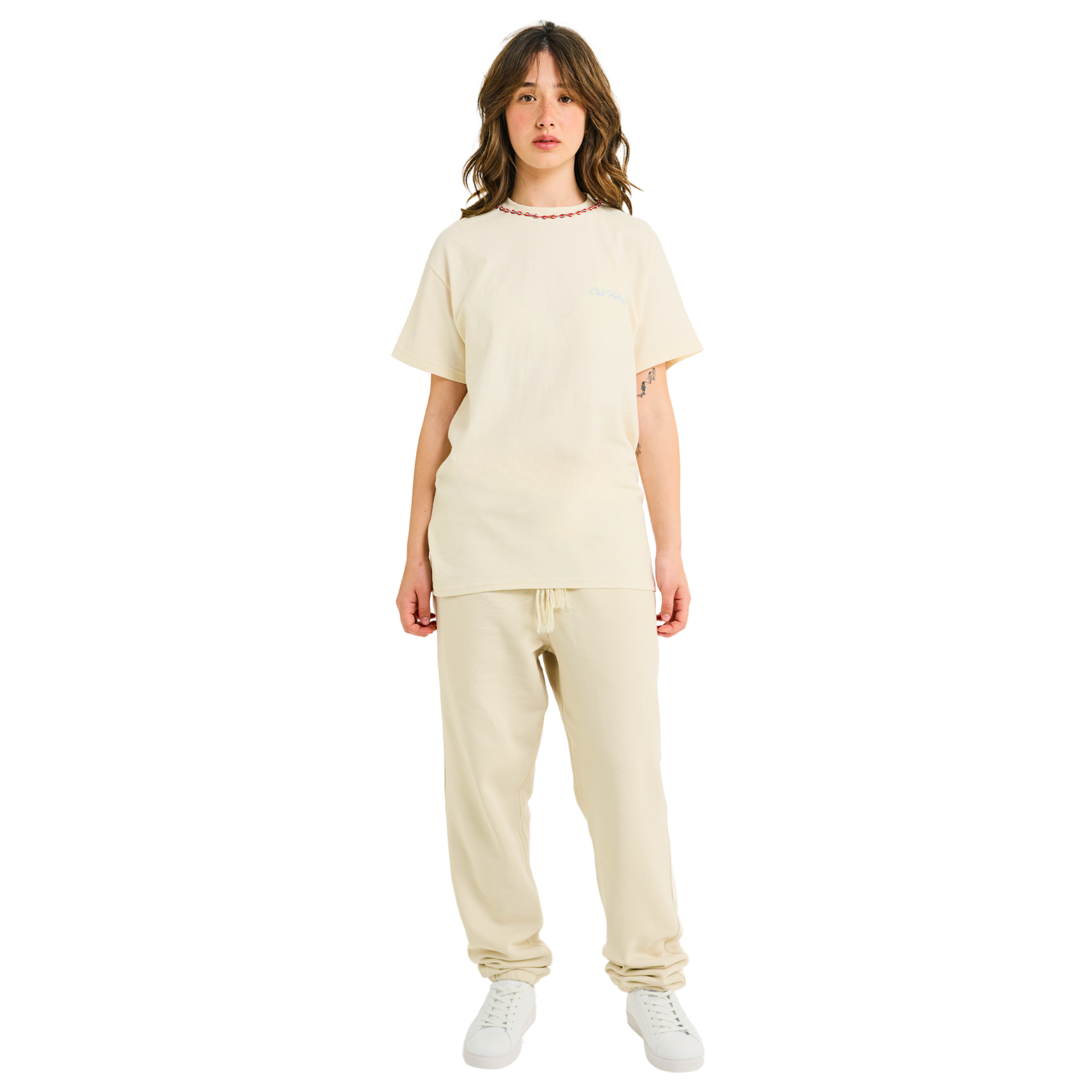 Female model wearing natural cotton T-shirt with small front logo and braided neckline, front view