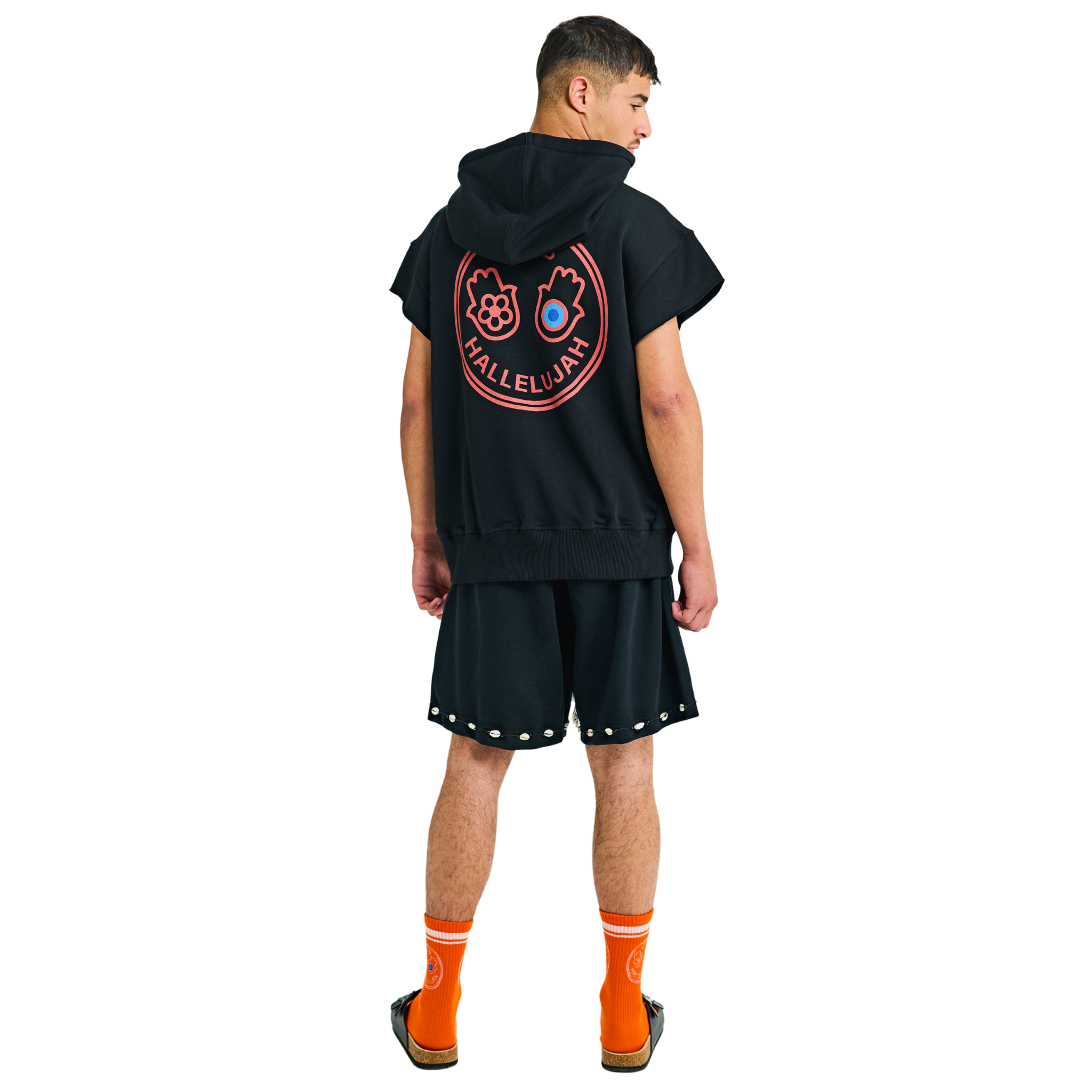 Back view of male model wearing Mogador Nights hoodie with graphic print and short sleeves