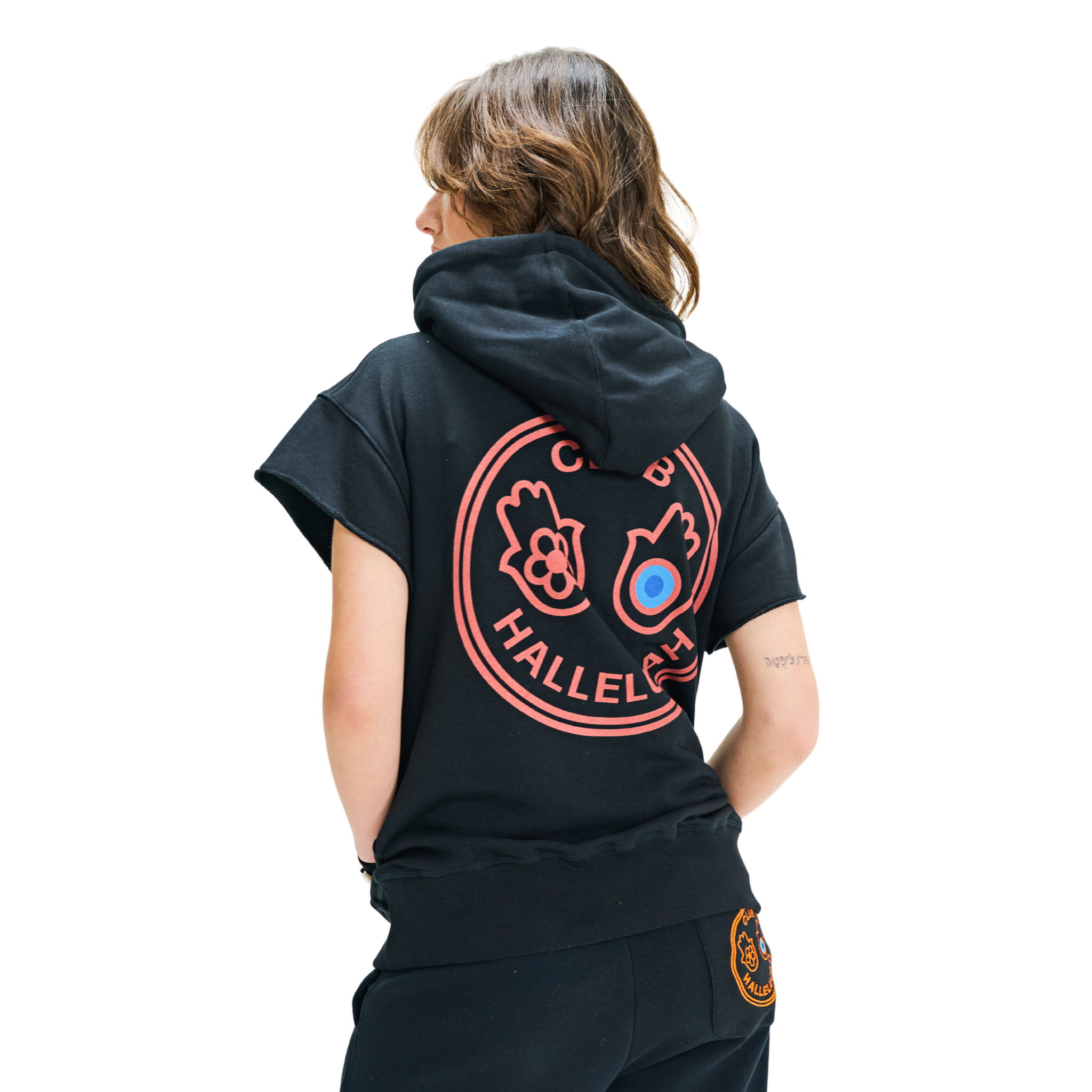 Back view of female model in Mogador Nights hoodie with large hamsa graphic print, short sleeves, and hood