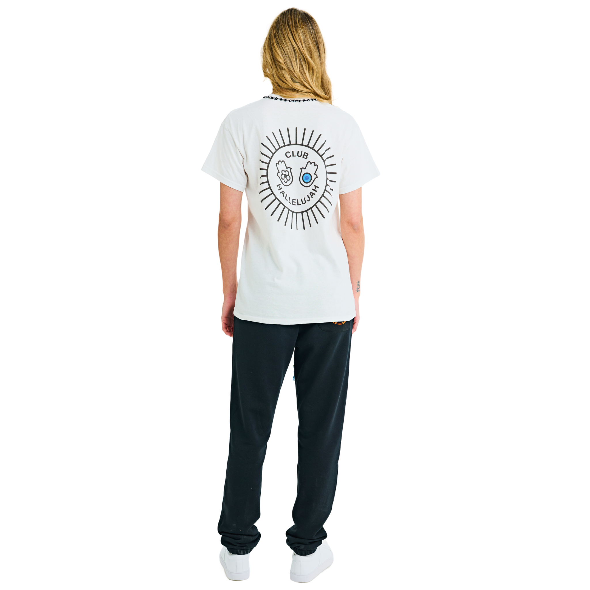 Female model wearing white T-shirt, back view, showing sunburst print and braided neckline