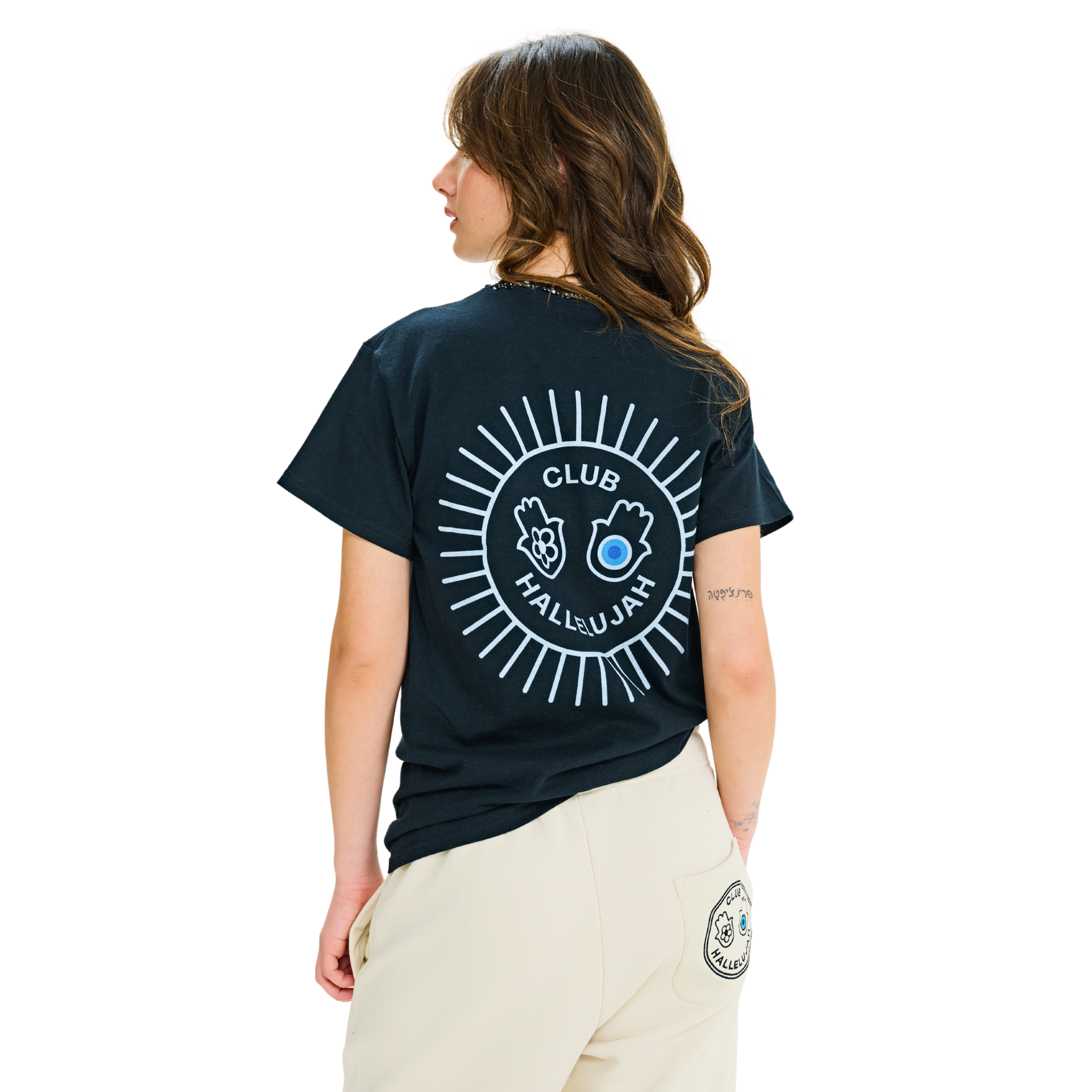 Female model wearing black T-shirt, back view, with white sunburst print and braided neckline