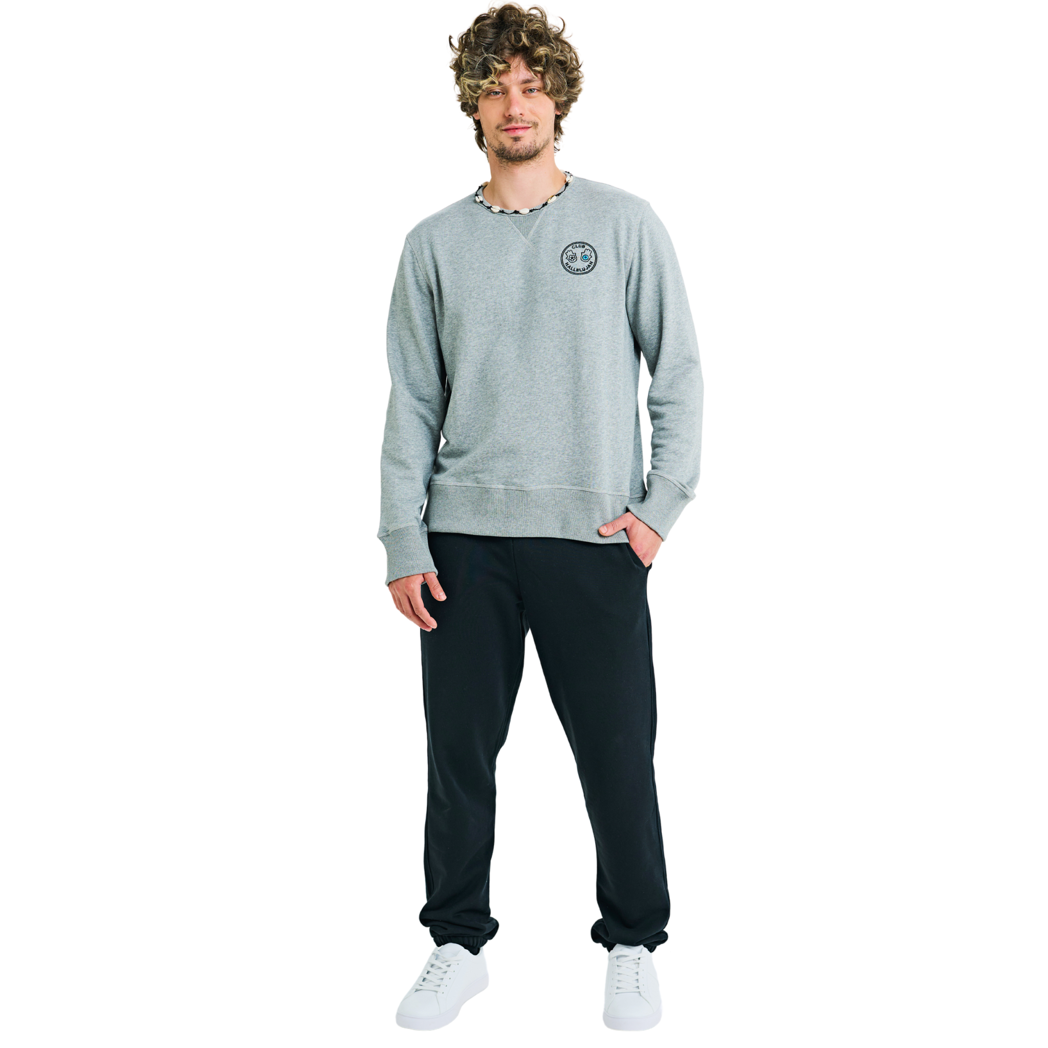 Front view of male model wearing grey mélange sweatshirt with embroidered logo and braided shell-trimmed neckline