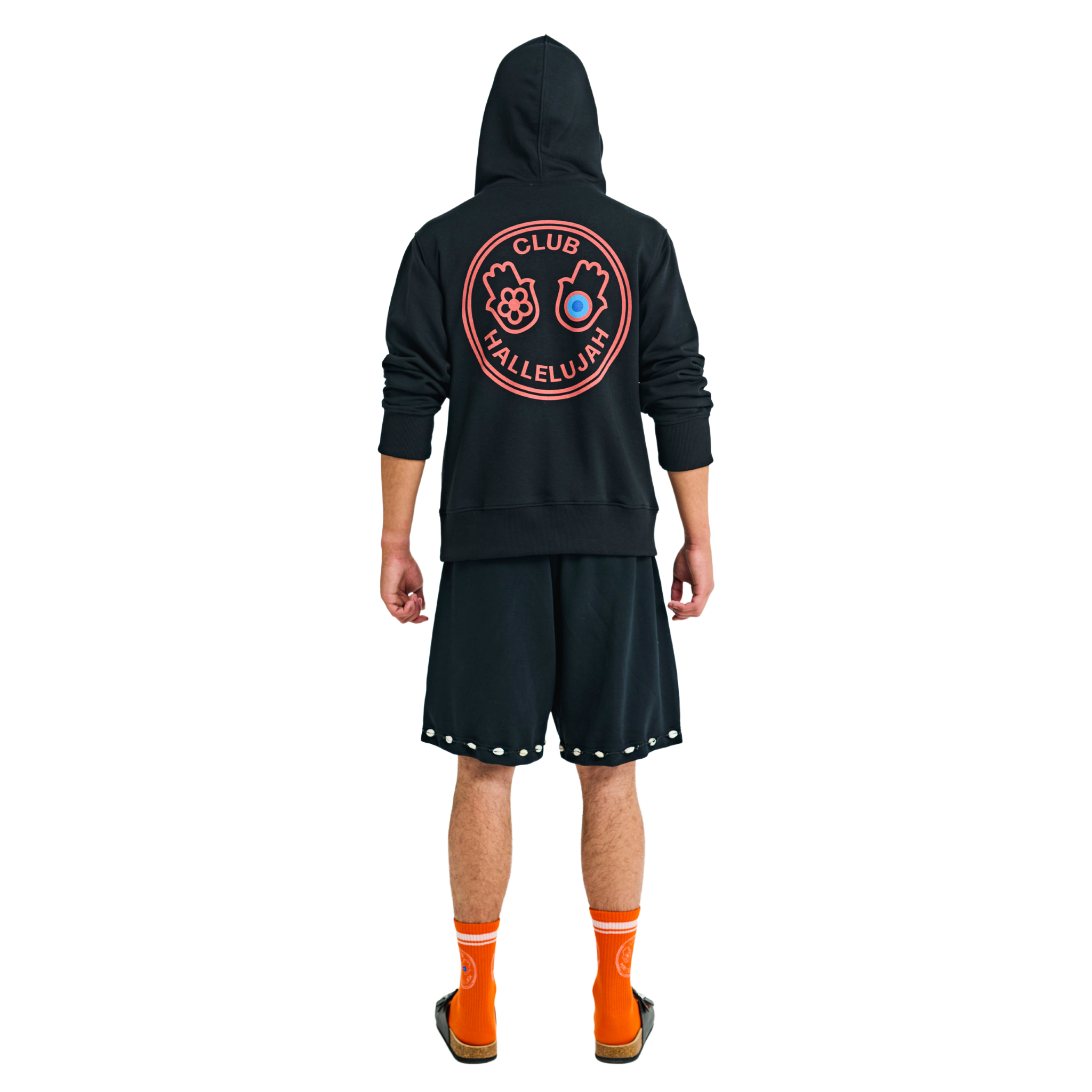 Back view of male model in long-sleeve hoodie with large embroidered graphic, handmade details, and woven hood straps