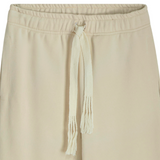 Close-up of woven cotton drawstring and waistband on stone classic sweatpants with handmade details