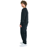 Side view of male model in unisex black sweatshirt with embroidered logo and handmade braided shell neckline