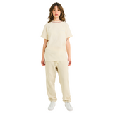 Female model wearing natural cotton T-shirt with small front logo and braided neckline, front view