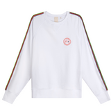 Front view of white oversized raglan sweatshirt with embroidered logo and handmade multicolor braided sleeves