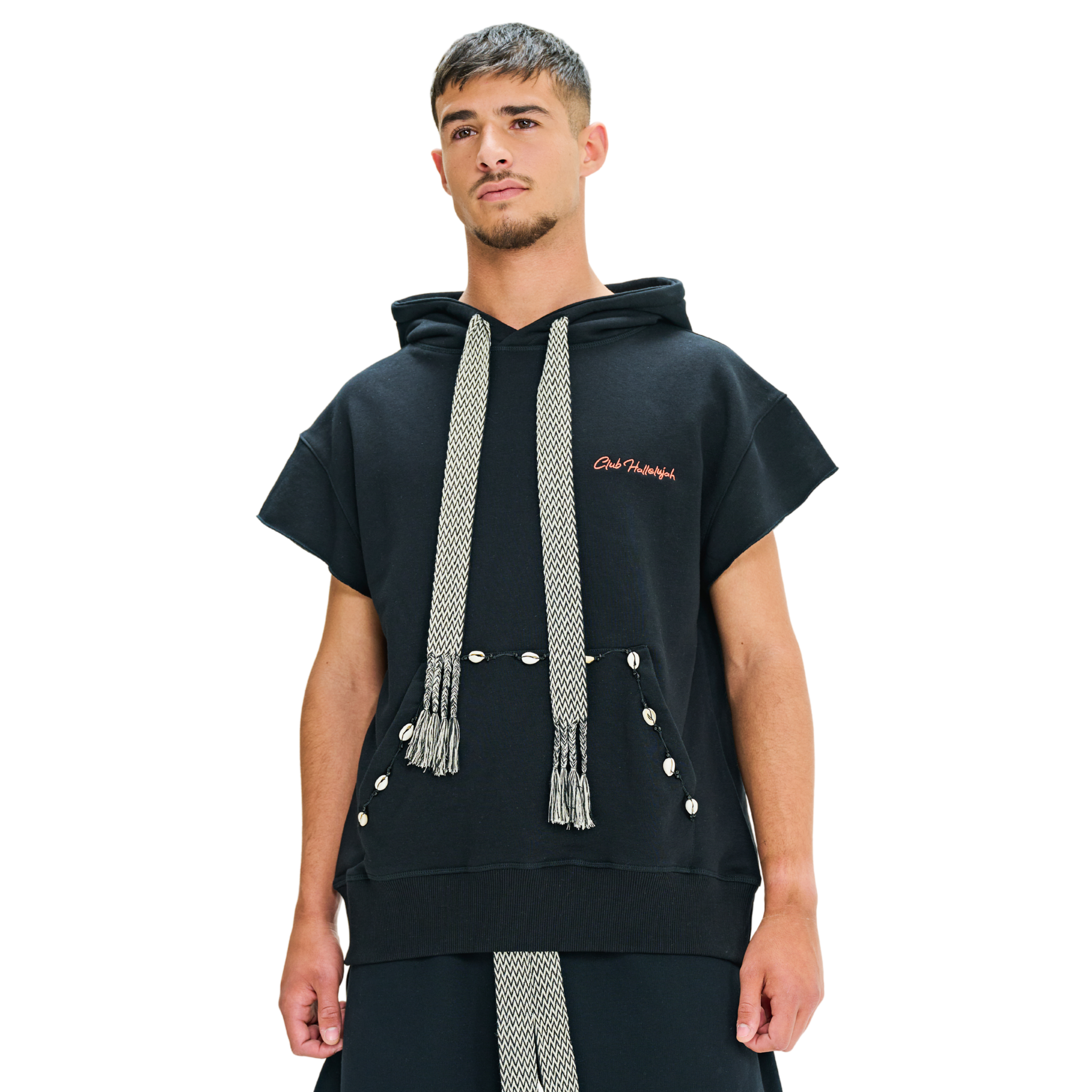 Male model front view wearing Mogador Nights short-sleeve hoodie with tassels and cowrie shells