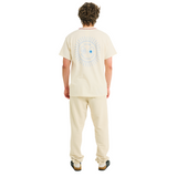 Male model wearing natural cotton T-shirt, back view, showing light blue sunburst print and braided neckline, full body