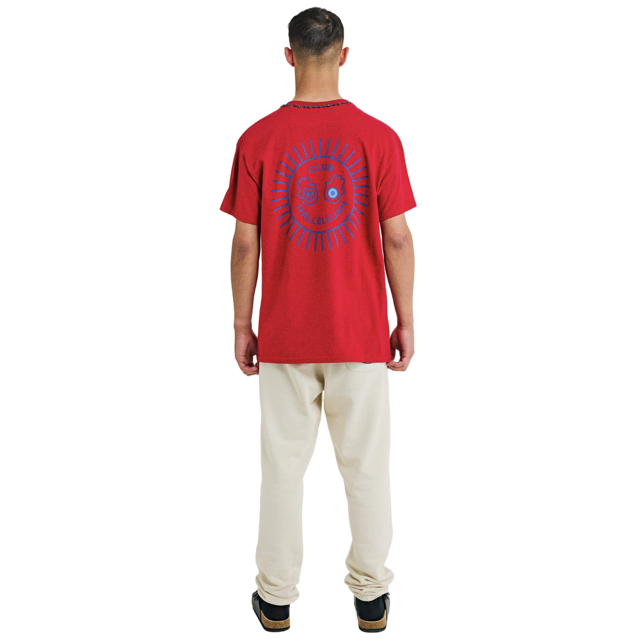 Male model wearing red mélange T-shirt, back view, showing blue sunburst print and braided neckline