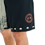 Close-up of unisex black shorts, hand-braided drawstring, cowrie shell hem, and Club Hallelujah embroidered logo on front