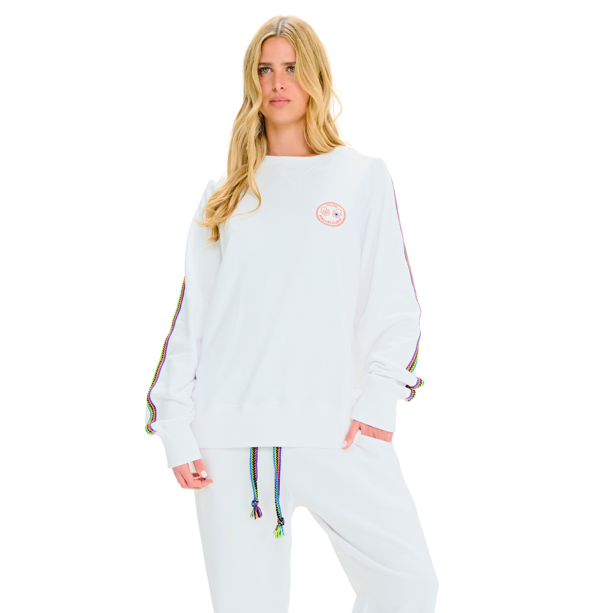 Female model front view in white oversized sweatshirt with embroidered logo and braided handmade sleeve details
