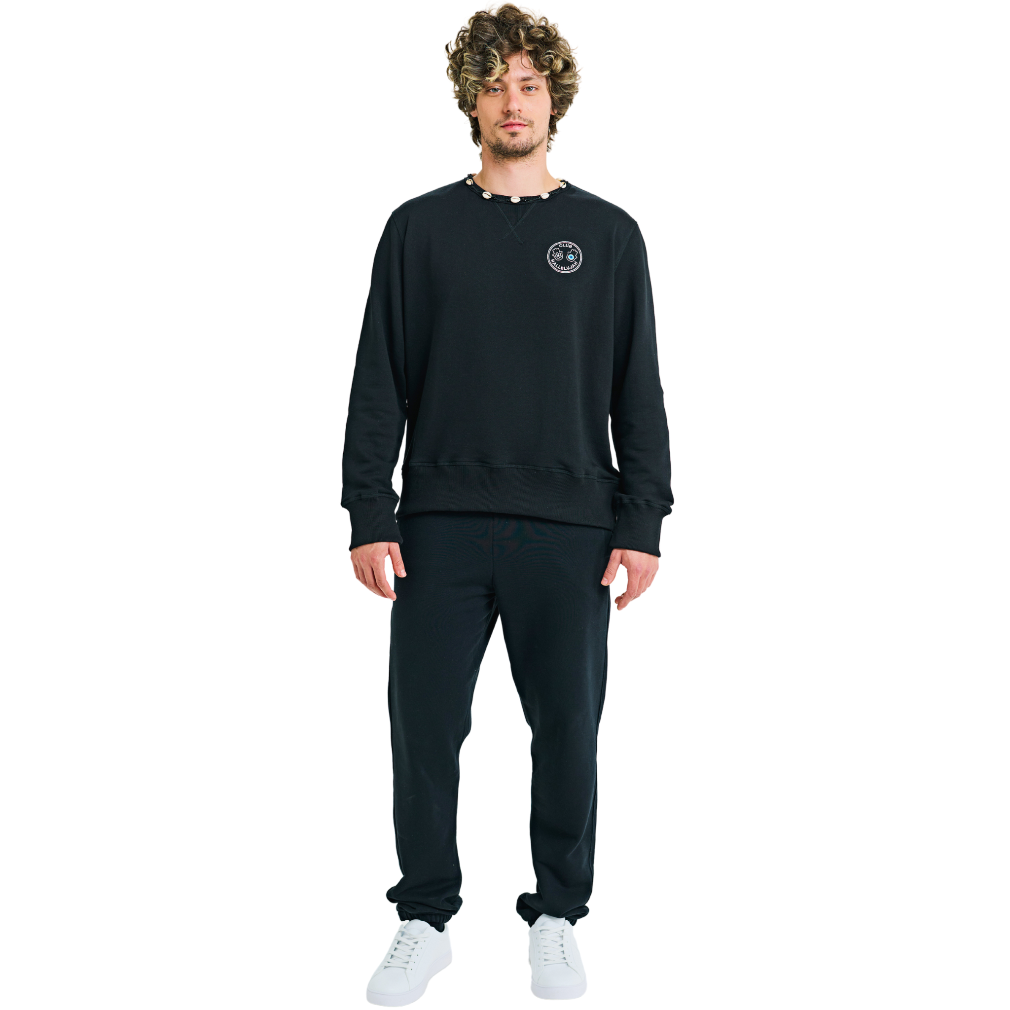 Front view of male model wearing unisex black sweatshirt with embroidered chest logo and braided shell neckline