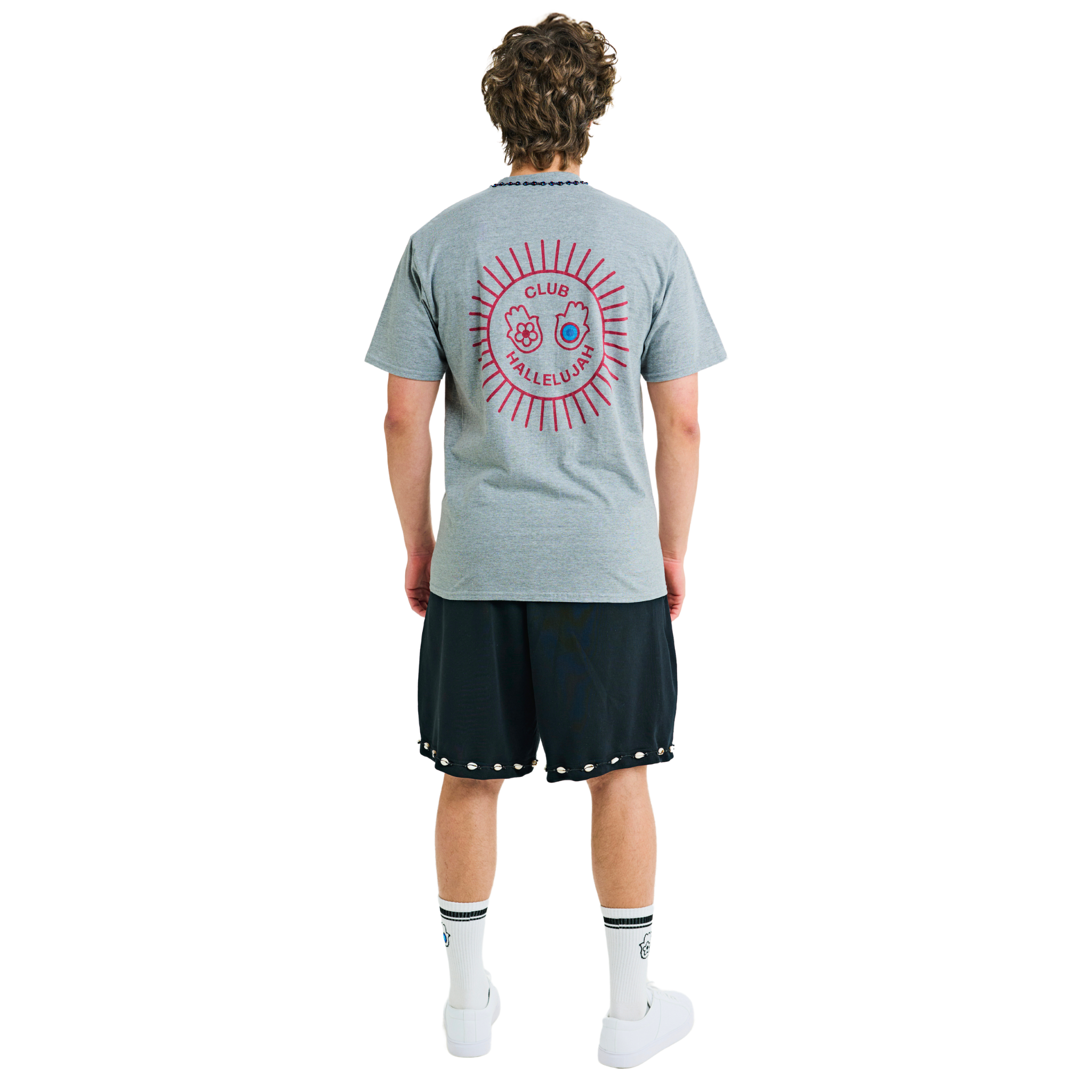 Male model wearing ash grey mélange T-shirt, back view, showing red sunburst print and braided neckline