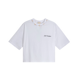 White organic cotton crop top with small 'Club Hallelujah' front logo and cowrie shell neckline, front view