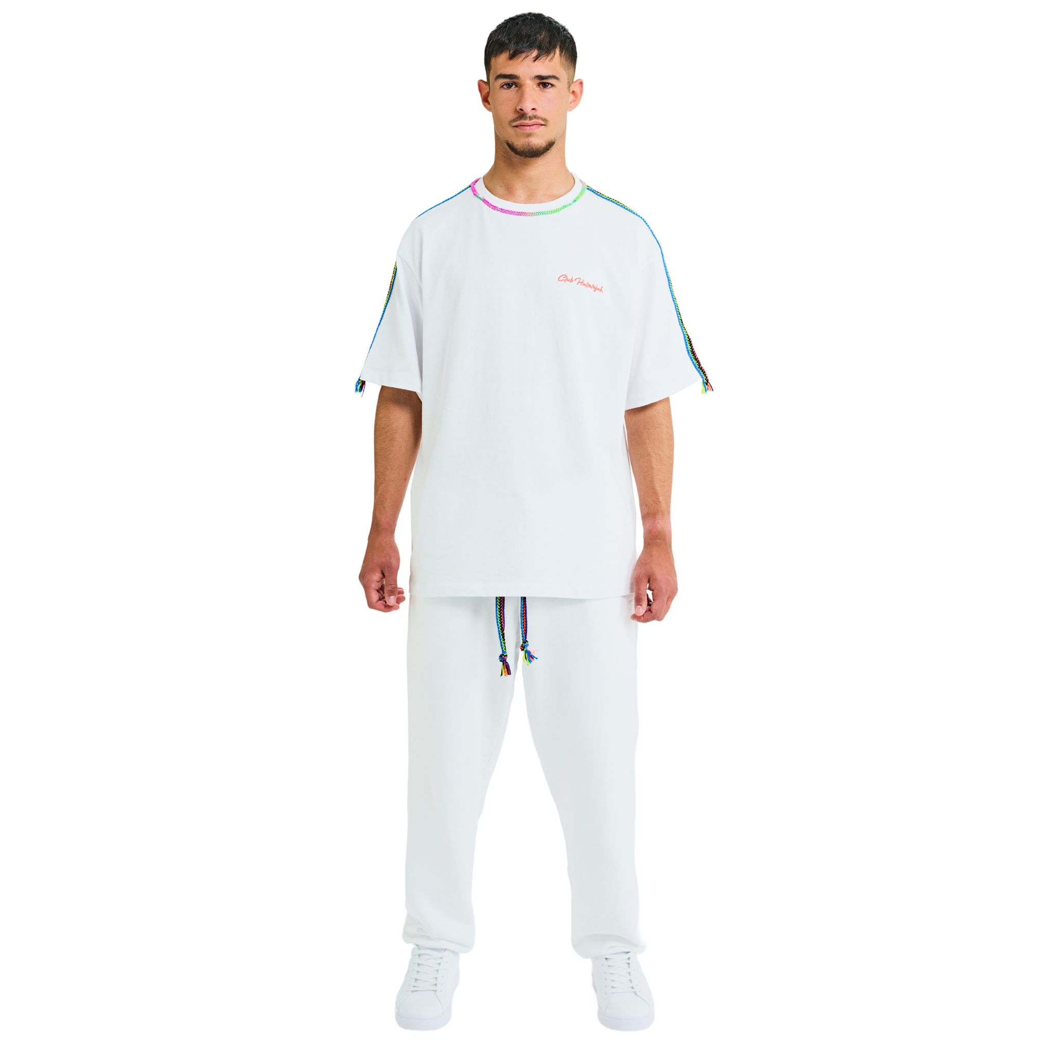 Male model front view in white oversized T-shirt with embroidered chest logo and braided handmade shoulders