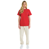 Female model wearing red mélange T-shirt with small front logo and braided neckline, front view