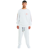 Male model front view wearing white oversized sweatshirt with embroidered logo and braided handmade sleeves