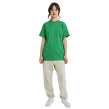 Female model wearing green mélange T-shirt with small front logo and braided neckline, front view