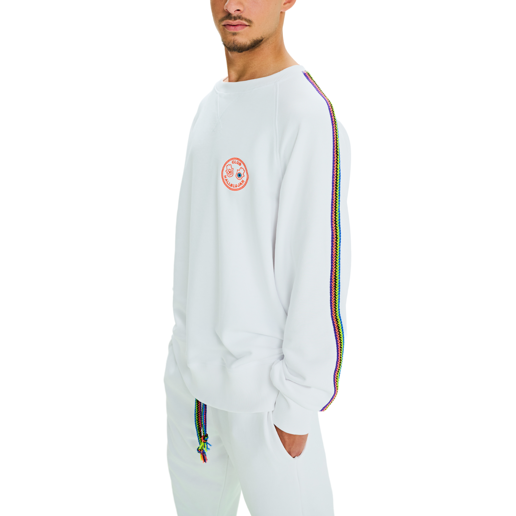Side view of male model wearing white oversized sweatshirt with handmade braided sleeves and embroidered logo