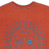 Close-up of blue sunburst 'Club Hallelujah' print on orange mélange cotton T-shirt, back view