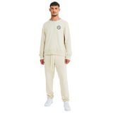 Front view of male model wearing unisex stone sweatshirt with embroidered logo and braided shell-trimmed neckline