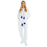 Female model front view in unisex white hoodie, handmade blue tassel drawstring, cowrie shell details, 100% cotton, relaxed fit