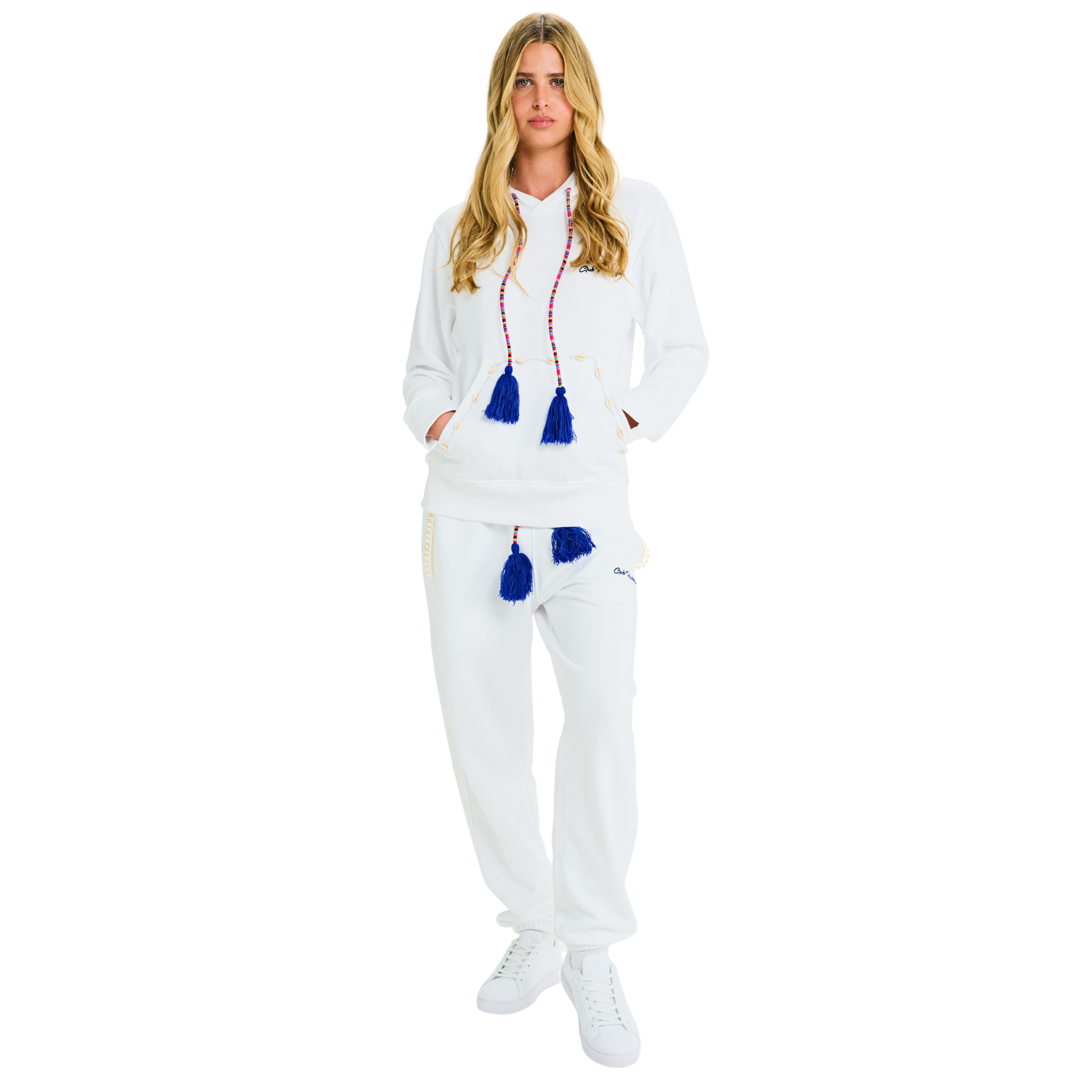 Female model front view in unisex white hoodie, handmade blue tassel drawstring, cowrie shell details, 100% cotton, relaxed fit