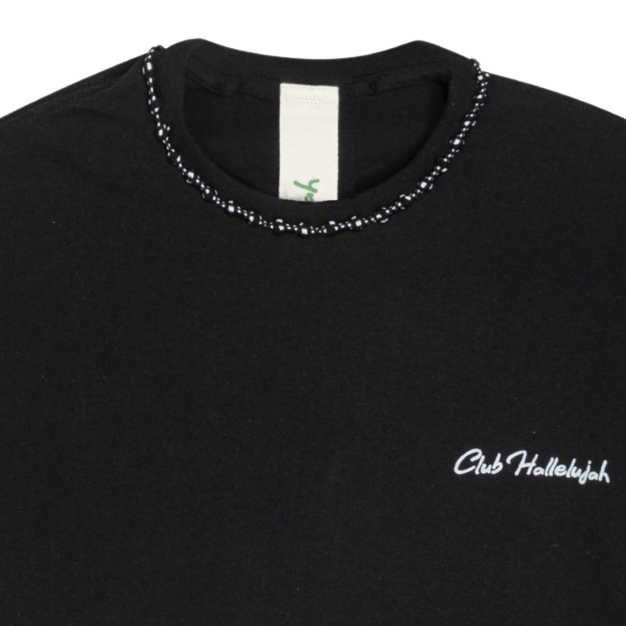 Close-up of black T-shirt neckline with handmade braided ribbon and small 'Club Hallelujah' logo