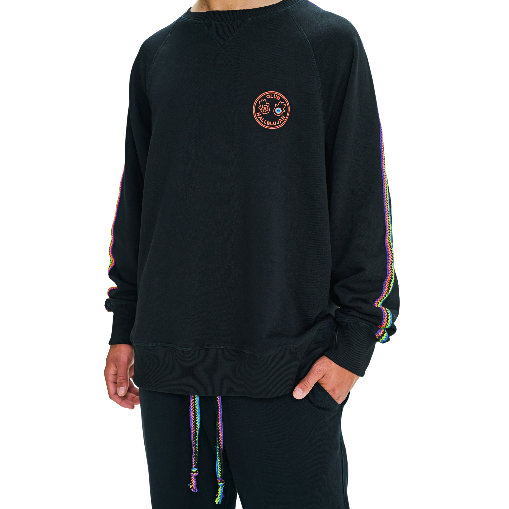 Male model front view in black oversized sweatshirt with embroidered logo and handmade details