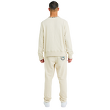 Back view of male model wearing unisex stone sweatshirt with braided shell-trimmed neckline and clean handmade details