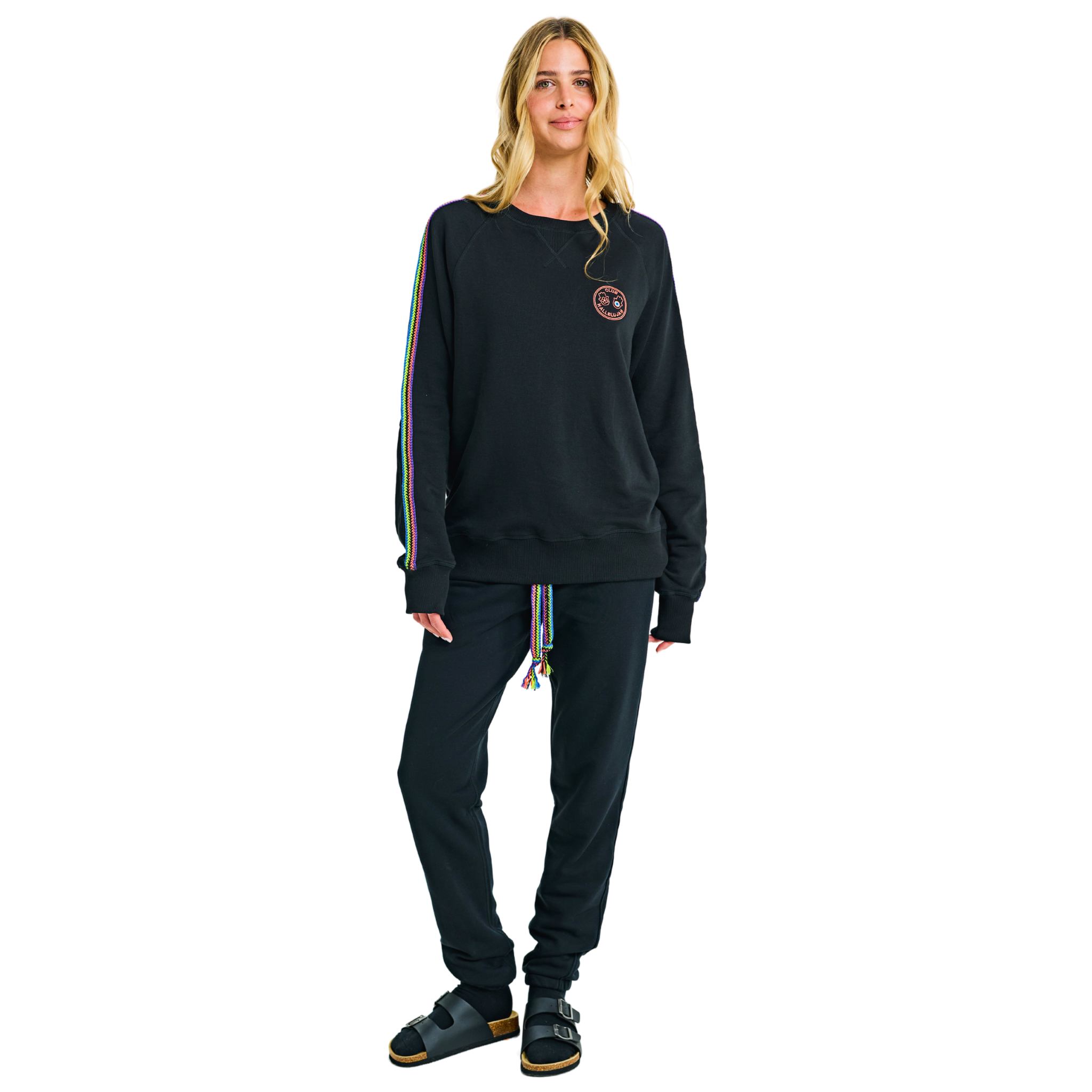 Female model front view in black oversized sweatshirt with embroidered logo and handmade details