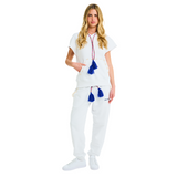 Full front view of female model in unisex white short-sleeved hoodie with blue tassel drawstring and cowrie shell details